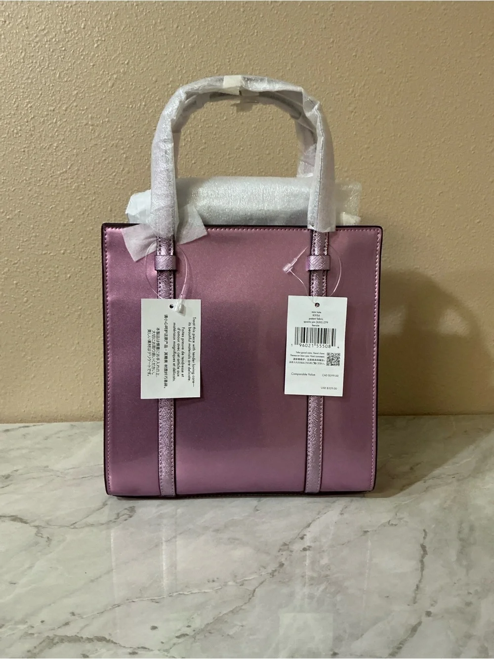 Kate Spade Mini Tote Metallic Quartz Pink.